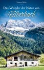 Text: "Das Wunder der Natur von Silberbach" und "Tamara Silvia". Eine Berghütte im Vordergrund mit majestätischen Bergen.