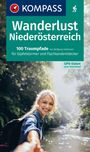 "Wanderlust Niederösterreich: 100 Traumpfade für Gipfelstürmer und Flachlandentdecker." Frau lächelt am Flussufer.