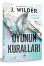 Text: "J. Wilder, OYUNUN KURALLARI". Glänzender Schmetterling und Eiskunstlaufschuhe auf buntem Hintergrund. Buchcover.