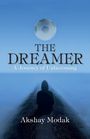 „THE DREAMER: A Journey of Unbecoming“ von Akshay Modak. Schattenfigur sitzt auf einem Weg, im Himmel ein Fußball.