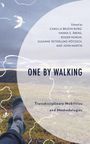 "ONE BY WALKING" steht groß in der Mitte, darunter "Transdisciplinary Mobilities and Methodologies". Im Hintergrund Füße auf Gras.