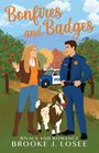 Titel: "Bonfires and Badges". Untertitel: "Rivals and Romance". Unten steht "Brooke J. Losee". Ein Polizist, eine Frau und eine Ziege mit Apfel.