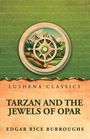 Text: "Lushena Classics. Tarzan and the Jewels of Opar. Edgar Rice Burroughs." Illustration eines Kompasses vor Berglandschaft.