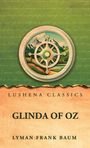 Texte: Lushena Classics, Glinda of Oz, Lyman Frank Baum. Ein Kompass über Landschaft mit Bergen auf grünem Hintergrund.