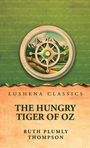 Lushena Classics. The Hungry Tiger of Oz. Ruth Plumly Thompson. Illustration mit Kompassrad und Berglandschaft.