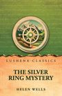 „Lushena Classics - The Silver Ring Mystery - Helen Wells“. Oben Illustration mit Bergen und einem Kompass auf grünem Hintergrund.