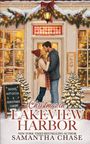 "Christmas in Lakeview Harbor" von Samantha Chase. Schneeszene mit Paar vor einem weihnachtlich geschmückten Buchladen.